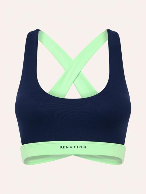 P.E NATION CURVE SPORTS BRA IN DARK NAVY & KIWI GREEN