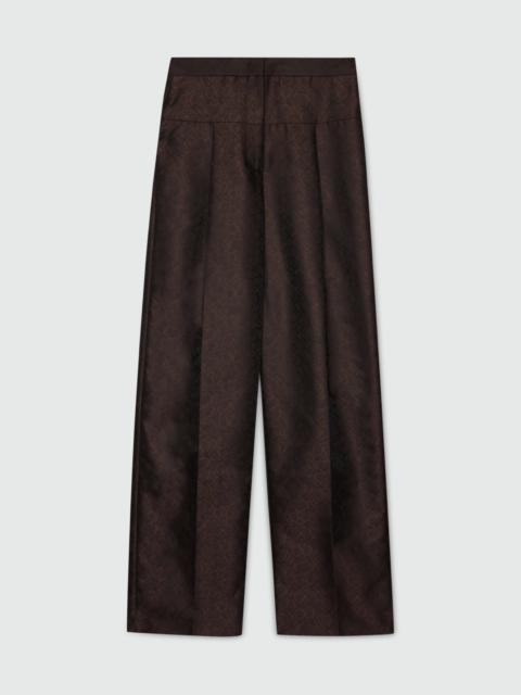 MSGM Brown wide-leg jacquard trousers with python print.