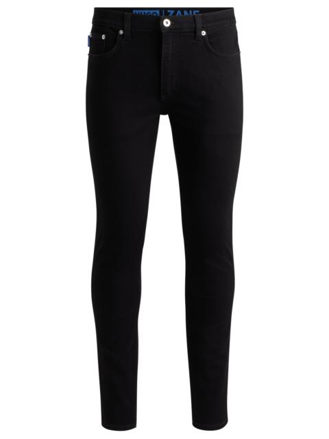 HUGO EXTRA-SLIM-FIT JEANS IN BLACK STRETCH DENIM