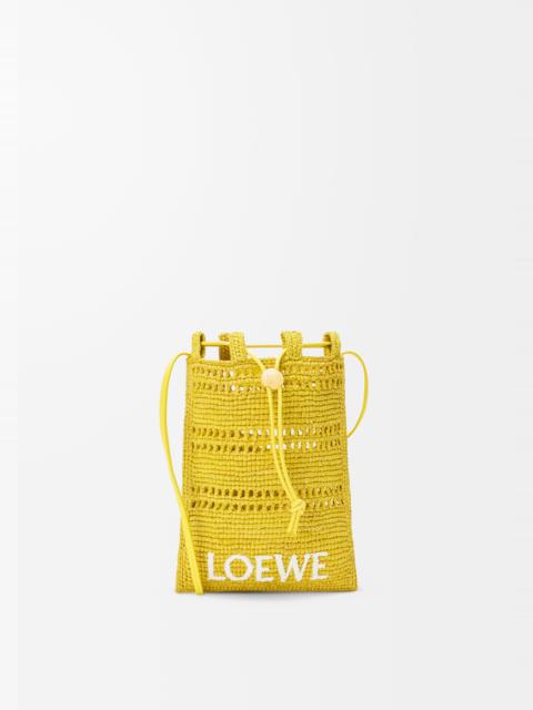 Drawstring pocket in raffia