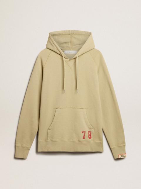 Pale eucalyptus-colored hoodie with front pocket