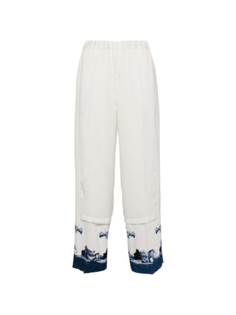 UNDERCOVER graphic-print panelled trousers