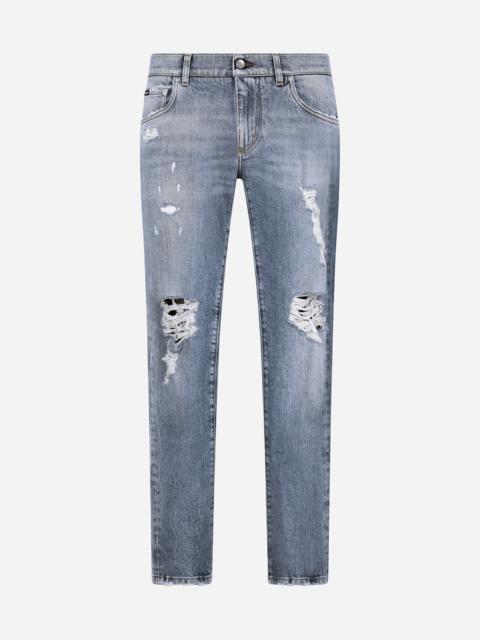 Blue wash skinny stretch jeans with rips