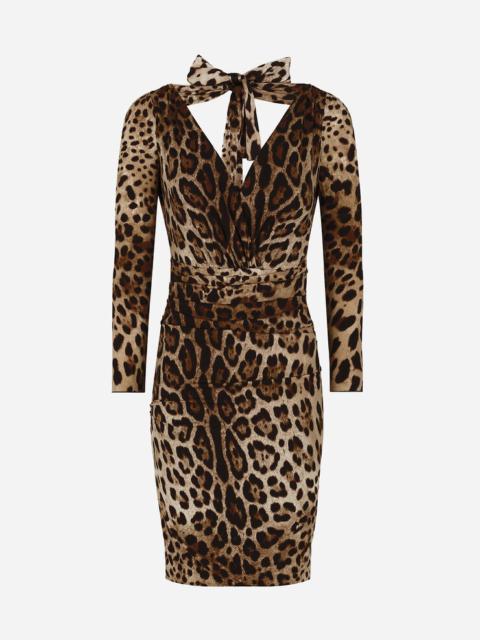 Short charmeuse dress with leopard print and tie