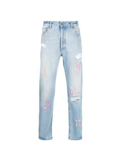 Palm Angels ripped embroidered tapered jeans