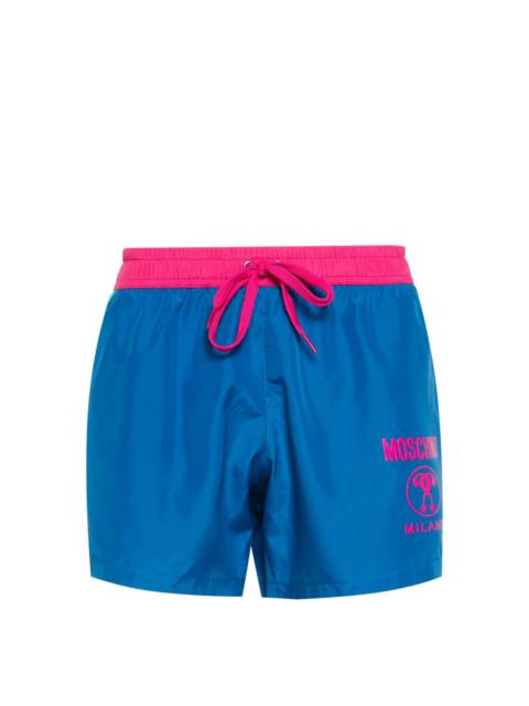 Moschino logo-print colourblock swim shorts
