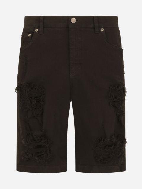 Dolce & Gabbana Black denim shorts with rips and patch embellishment