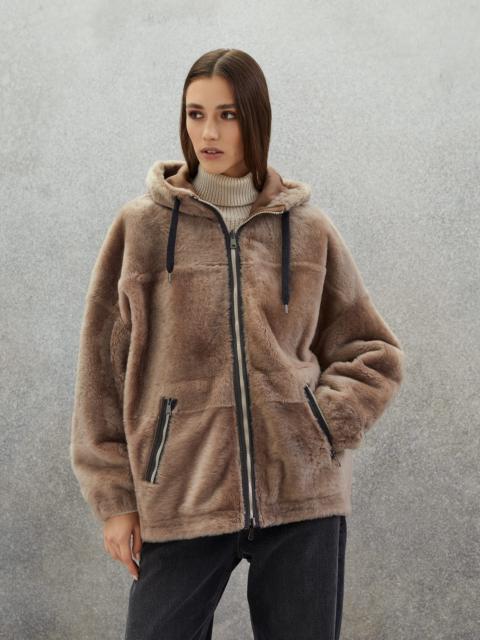 Reversible shearling parka with shiny trim