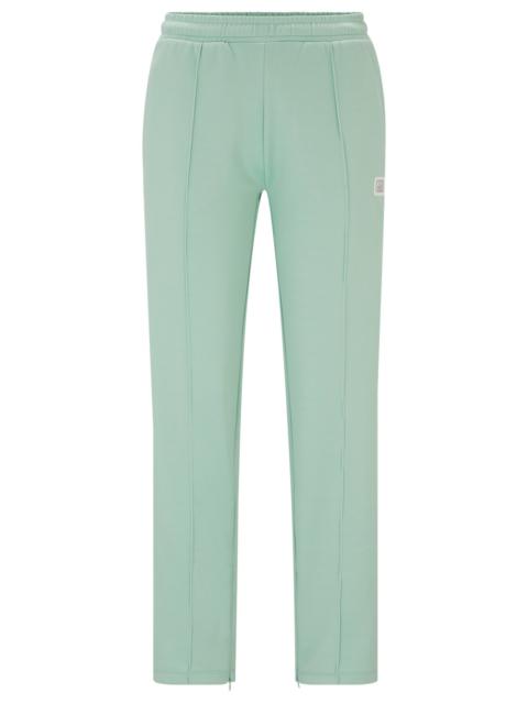 HUGO STRAIGHT-FIT TRACKSUIT BOTTOMS WITH STACKED LOGO