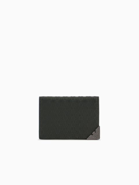 Leather card holder with flap and all-over embossed pattern