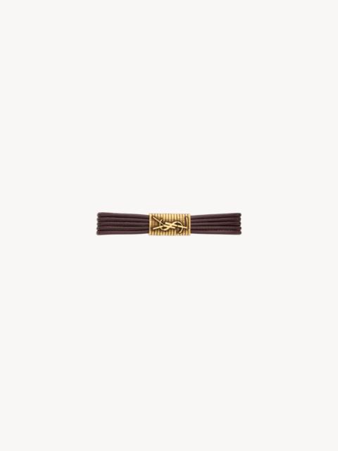 SAINT LAURENT CASSANDRE CORD BRACELET IN LEATHER AND METAL