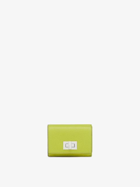 FENDI Compact, tri-fold Peekaboo wallet with large internal bill compartment and three concealed card hold