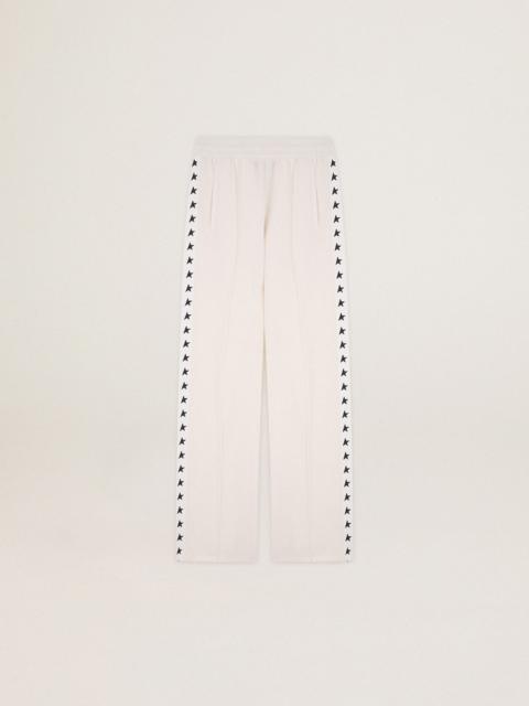 Women’s white joggers with stars on the sides