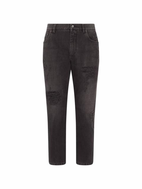 distressed mid-rise tapered jeans