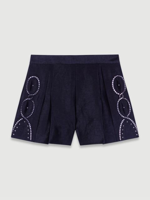 Openwork linen shorts with rivets