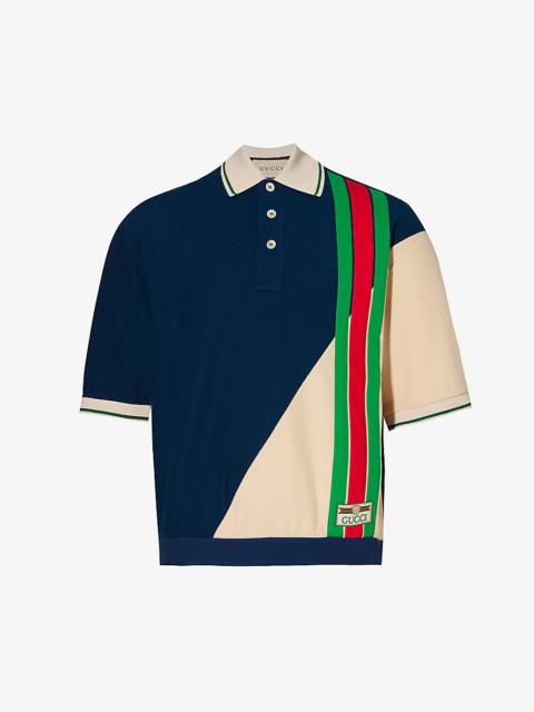 Logo-patch striped wool and cotton-blend polo shirt