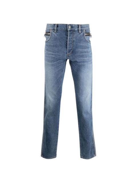 Balmain embossed-logo tapered jeans
