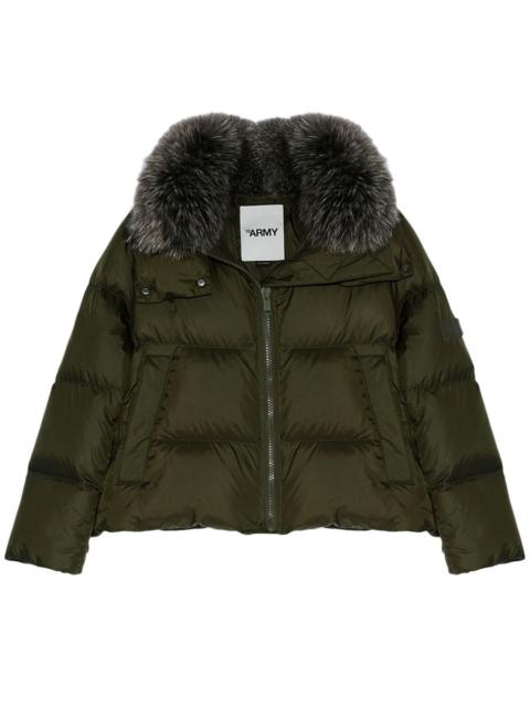 Short A-line puffer jacket made from a water-resistant performance fabric with a fox fur collar