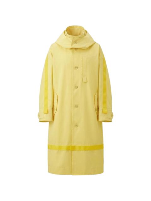ISSEY MIYAKE Carrier Carried hooded logo-print coat