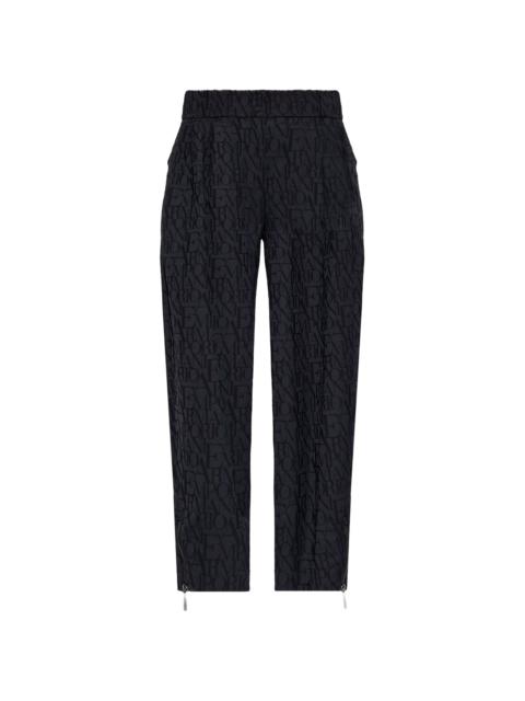 monogram-print tapered trousers