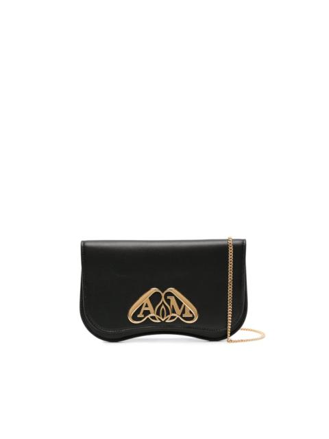 Seal-plaque leather clutch bag