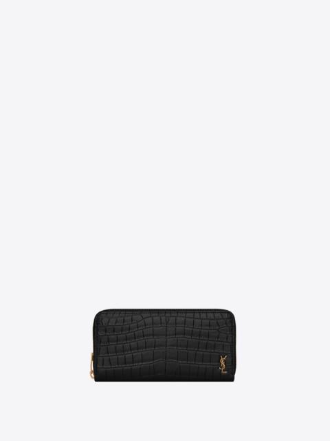 tiny cassandre zip-around wallet in crocodile-embossed matte leather