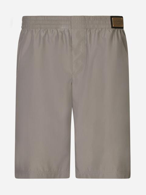Dolce & Gabbana Long-leg swim trunks with branded tag