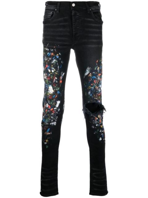 AMIRI paint print distressed skinny jeans