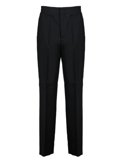 Moschino logo-trim trousers