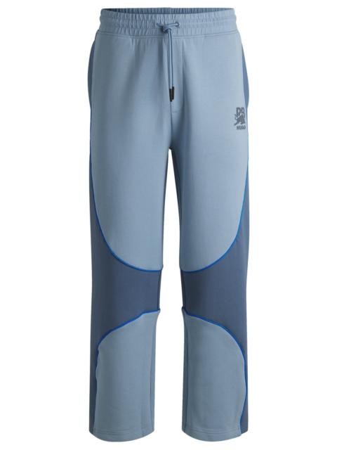 HUGO HUGO X RB TRACKSUIT BOTTOMS WITH PIPING DETAILS
