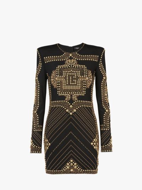 Short black dress with embroidered gold-tone studs