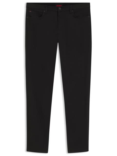 HUGO EXTRA-SLIM-FIT JEANS IN ULTRA-BLACK STRETCH DENIM