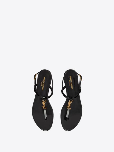 SAINT LAURENT cassandra flat sandals in patent leather with gold-tone monogram