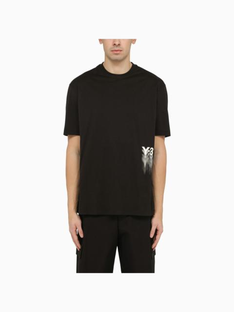 Black crew-neck t-shirt with logo blurs