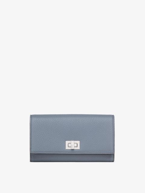 Peekaboo Selleria Trifold wallet with twist-lock fastening and outer compartment closed with a press