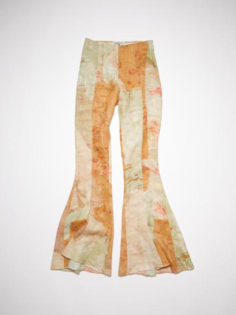 Acne Studios Carpet print flared trousers - Green/orange