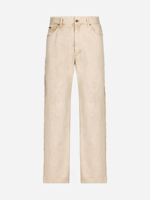 Dolce & Gabbana Overdyed jeans with raw hem details