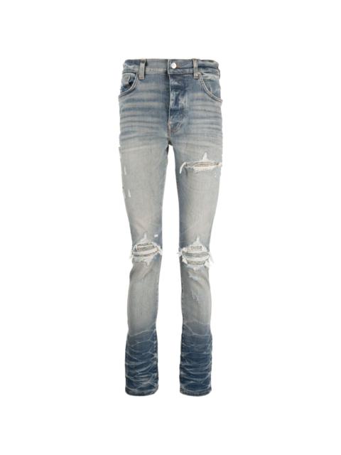 distressed slim-cut jeans