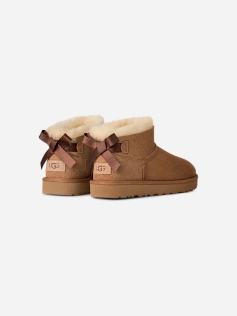 UGG ® Women's Ultra Mini Bailey Bow Sheepskin Classic Boots in Chestnut