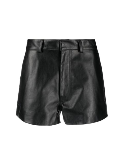 thigh-length leather shorts