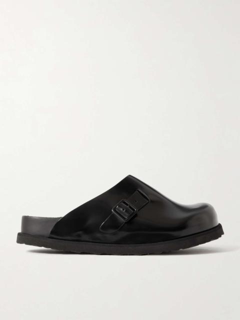 Niamey buckled glossed-leather clogs