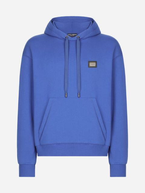 Jersey hoodie with branded tag