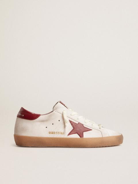 Super-Star in white suede with burgundy leather star and heel tab