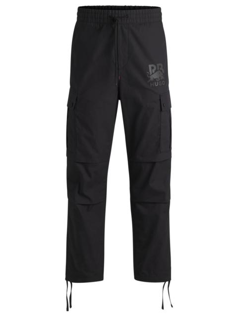 HUGO HUGO X RB REGULAR-FIT TROUSERS WITH CARBON STEALTH LOGO