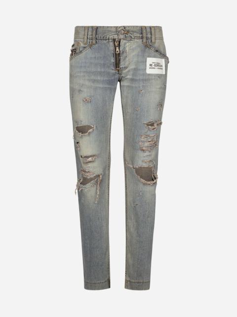 Washed denim jeans with rips
