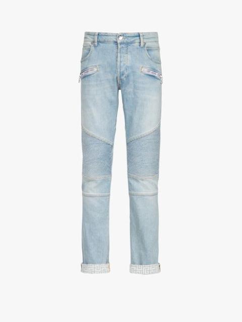 Balmain Slim cut faded and ridged light blue eco-designed denim cotton jeans with Balmain monogram on hem
