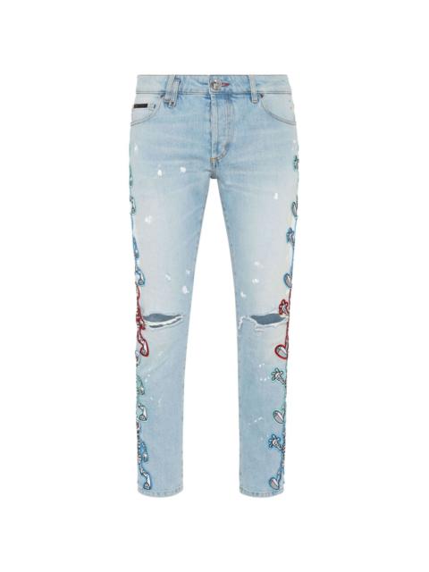 Skully Gang low-rise skinny jeans