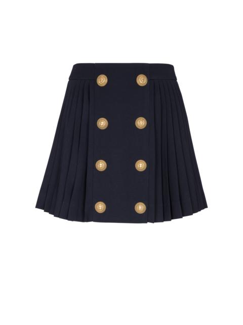 Pleated skirt with two rows of buttons