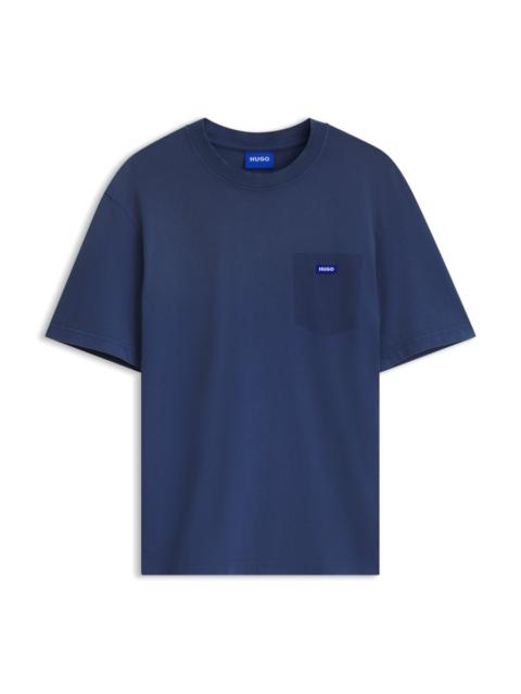 HUGO REGULAR-FIT T-SHIRT IN WASHED COTTON WITH LOGO BADGE