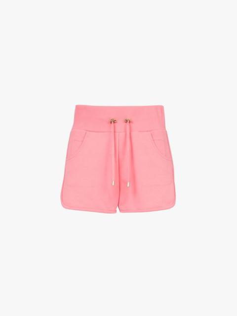 Salmon pink and white eco-designed knit shorts